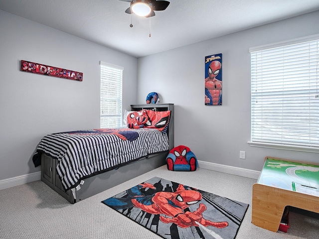 bedroom with ceiling fan and carpet floors