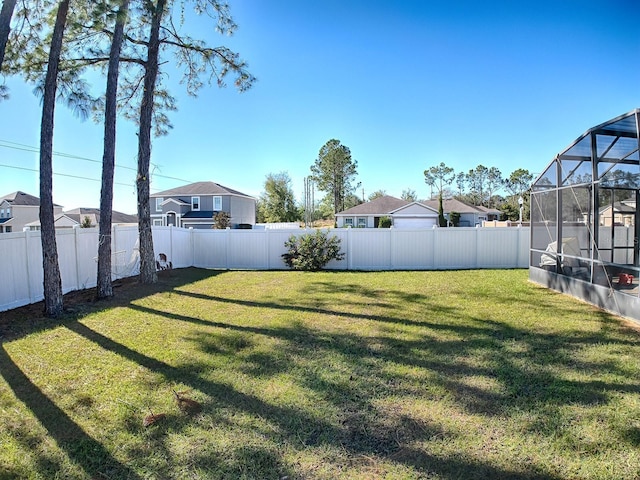 view of yard featuring a lanai