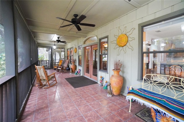 sunroom / solarium with ceiling fan