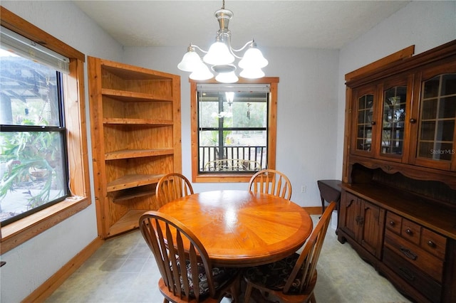 dining space with an inviting chandelier