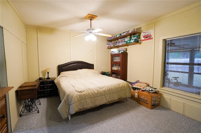 carpeted bedroom featuring ceiling fan