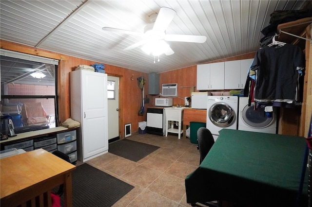 laundry room with separate washer and dryer, cabinets, ceiling fan, a wall mounted air conditioner, and wooden walls