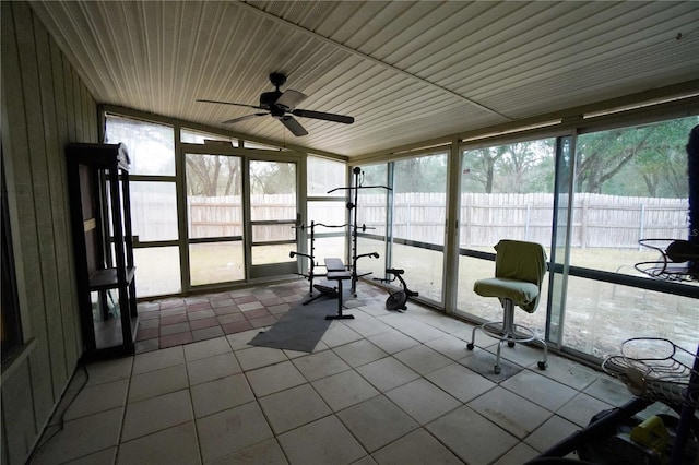 unfurnished sunroom with ceiling fan and a wealth of natural light