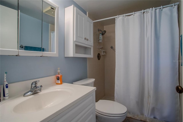 bathroom with a shower with curtain, vanity, and toilet