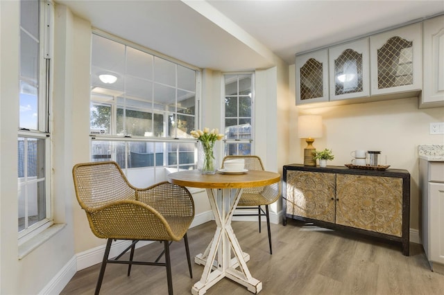 dining area with a healthy amount of sunlight and light wood-type flooring