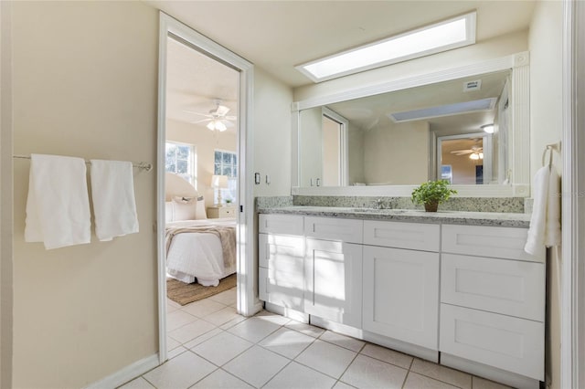 bathroom featuring tile patterned flooring and vanity