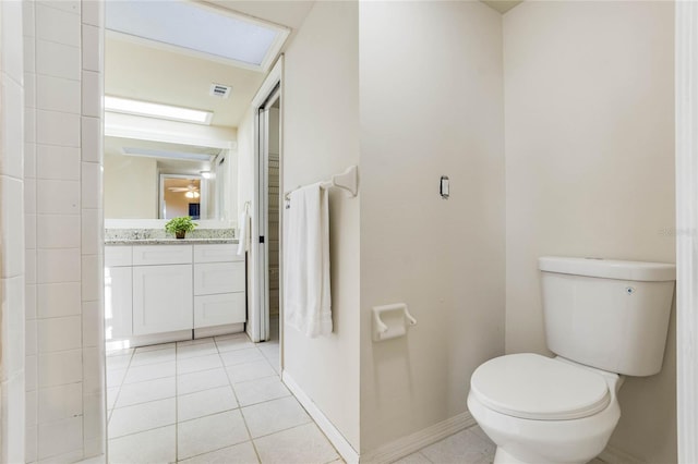 bathroom with tile patterned floors, vanity, and toilet