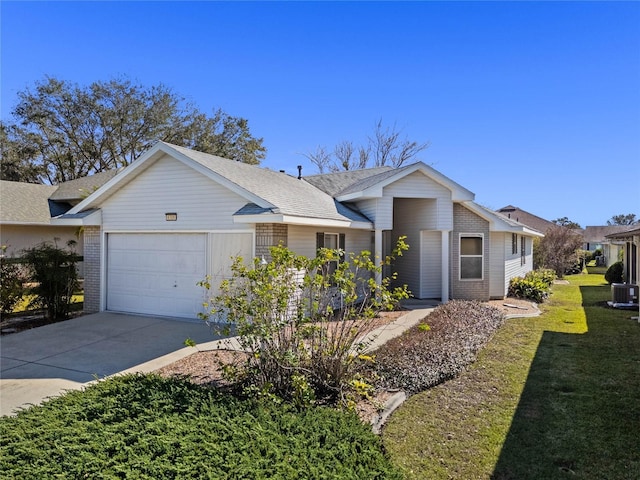 ranch-style home featuring a garage and a front lawn