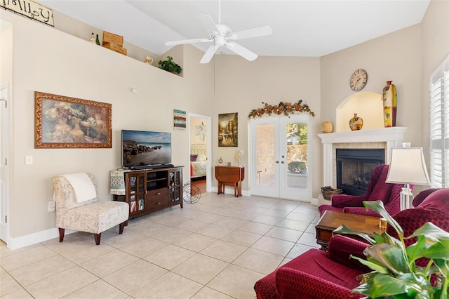 living room featuring a wealth of natural light, french doors, light tile patterned flooring, and ceiling fan