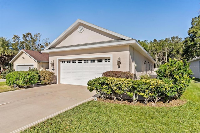 view of front of home featuring a garage and a front lawn