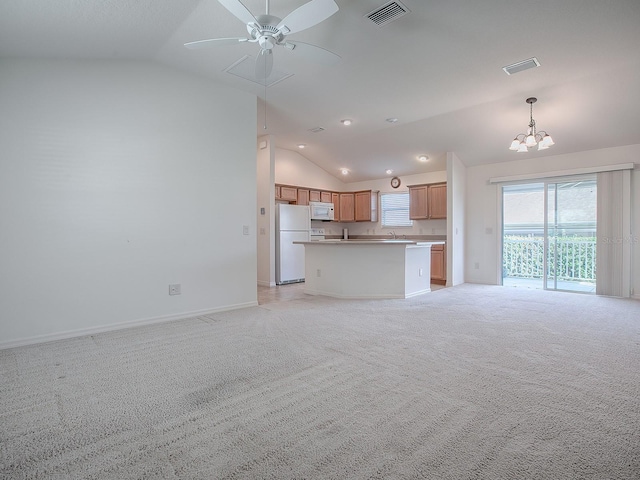 unfurnished living room with ceiling fan with notable chandelier, light colored carpet, vaulted ceiling, and sink