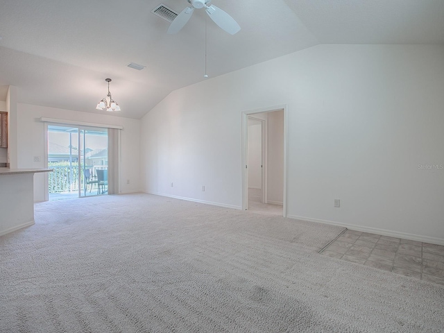 unfurnished living room featuring light carpet, ceiling fan with notable chandelier, and vaulted ceiling