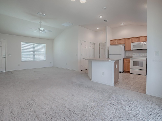 kitchen with lofted ceiling, ceiling fan, light colored carpet, and white appliances