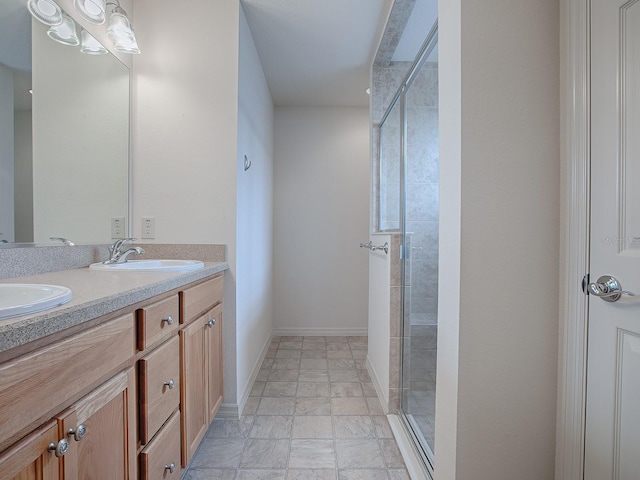 bathroom with vanity and an enclosed shower