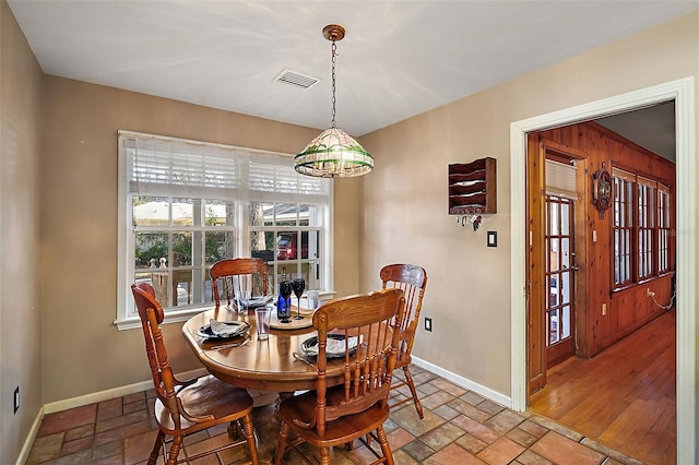 dining area featuring a notable chandelier