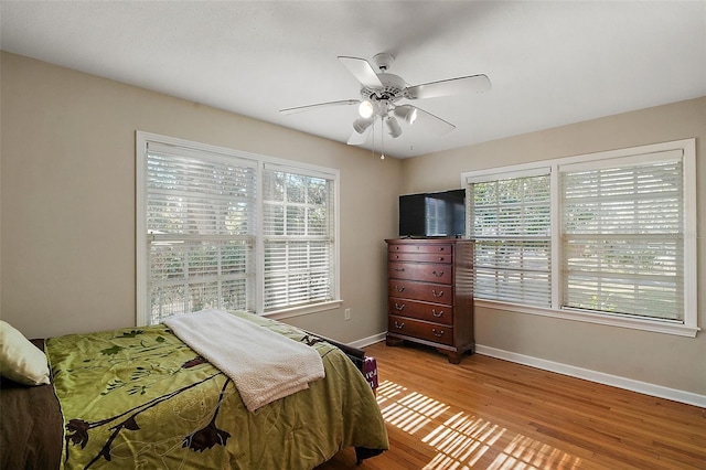 bedroom featuring ceiling fan and light hardwood / wood-style flooring