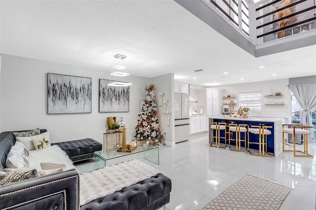 1087 Welch Hill Cir, Apopka, FL 32712 - living area with recessed lighting, light tile patterned flooring, and a textured ceiling