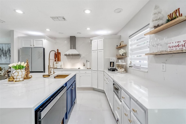 1087 Welch Hill Cir, Apopka, FL 32712 - kitchen with open shelves, wall chimney range hood, freestanding refrigerator, white cabinets, and recessed lighting