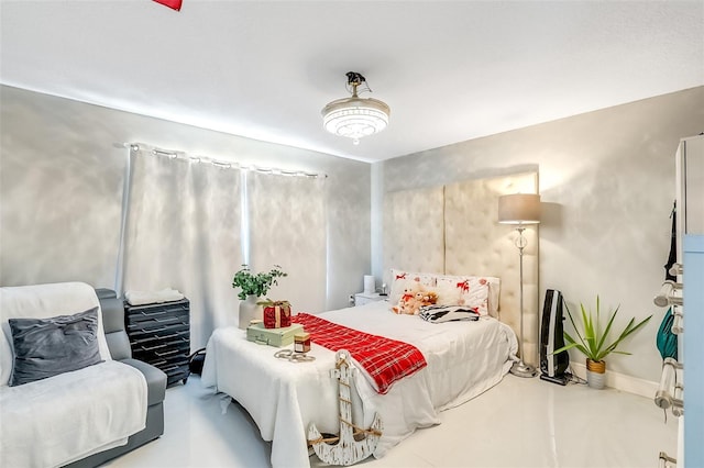 bedroom featuring concrete floors