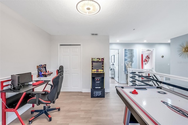 1087 Welch Hill Cir, Apopka, FL 32712 - office area with light wood finished floors, a textured ceiling, and baseboards