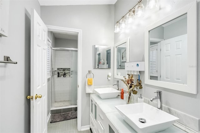 1087 Welch Hill Cir, Apopka, FL 32712 - full bathroom with a shower stall, double vanity, tile patterned flooring, and baseboards