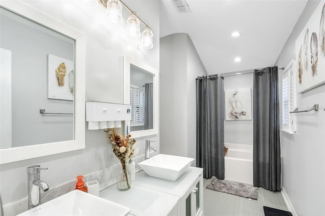 bathroom featuring vanity and shower / tub combo