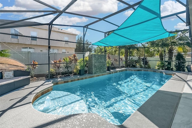 view of swimming pool featuring a lanai