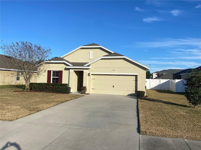 ranch-style home with a garage and a front lawn