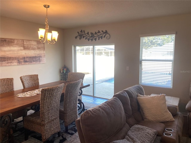 dining area with a notable chandelier