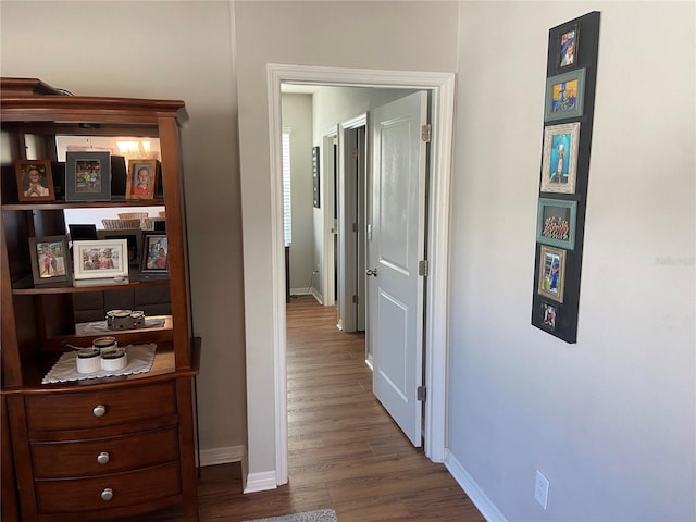 hall with dark hardwood / wood-style floors