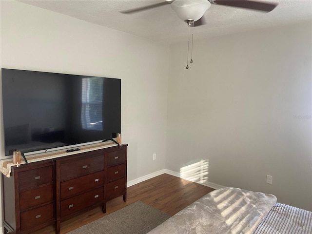 bedroom featuring ceiling fan and hardwood / wood-style floors