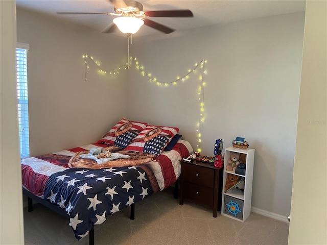 carpeted bedroom featuring ceiling fan