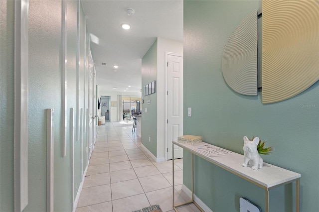 hallway featuring light tile patterned floors