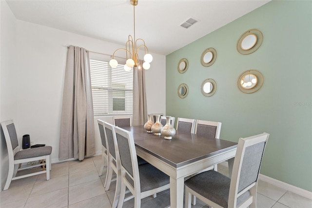 tiled dining area with a notable chandelier