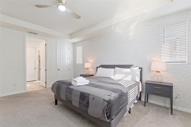 bedroom with light colored carpet and ceiling fan