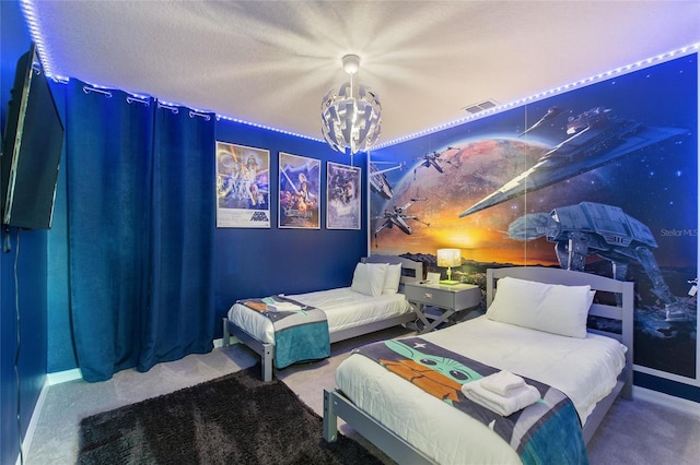 carpeted bedroom with a textured ceiling and an inviting chandelier