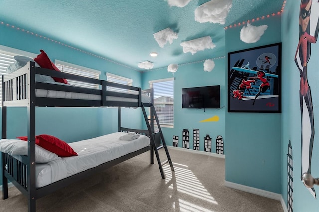 bedroom with a textured ceiling and carpet floors