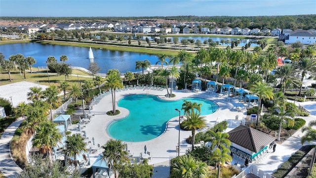 birds eye view of property with a water view