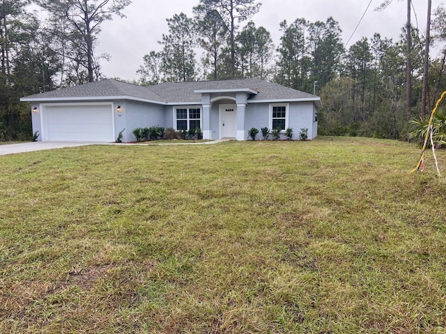 single story home featuring a front lawn and a garage