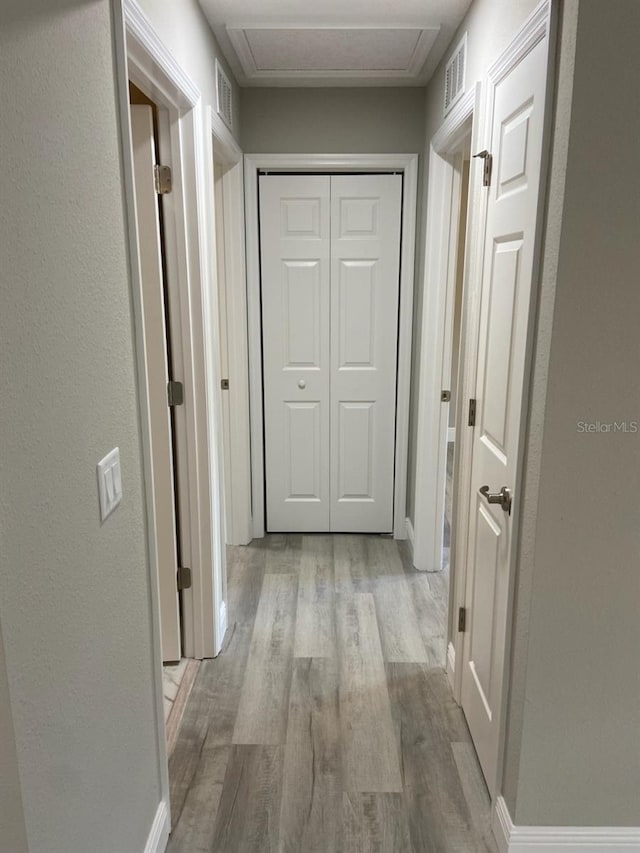 hallway featuring light hardwood / wood-style flooring