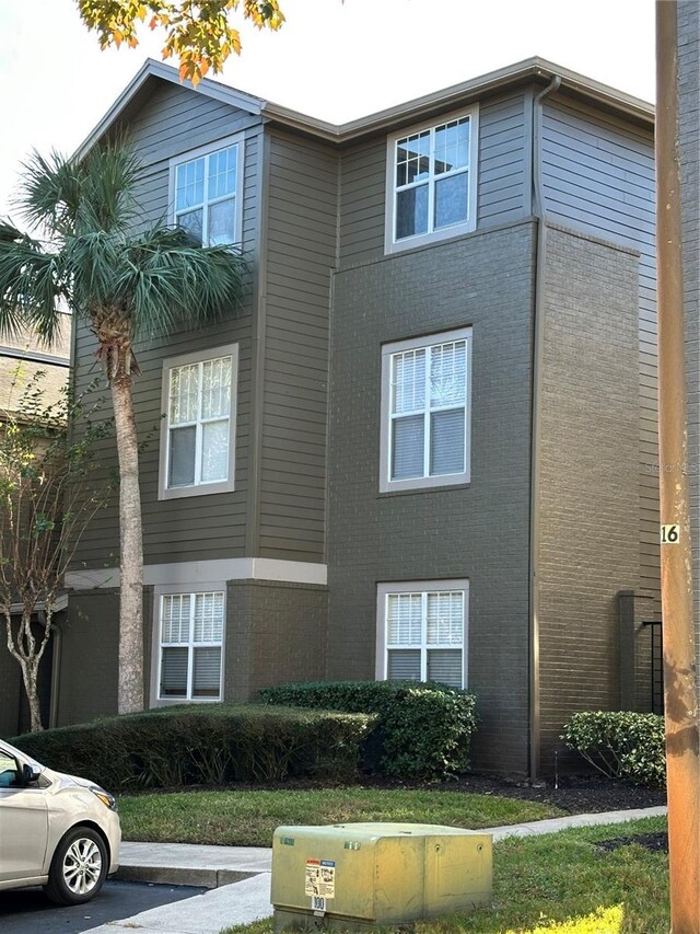420 Summit Ridge Pl Unit 214, Longwood, FL 32779 - view of property with uncovered parking