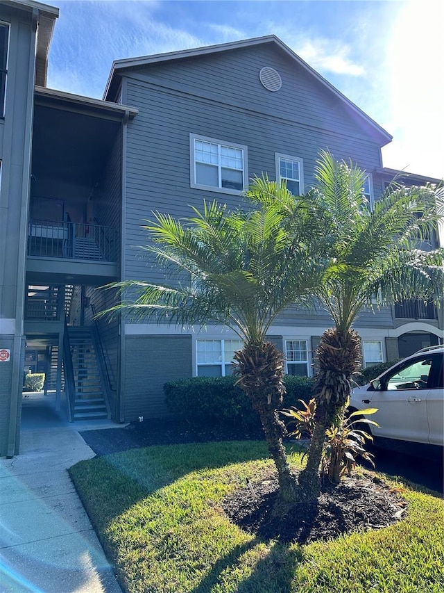 view of home's exterior featuring a yard