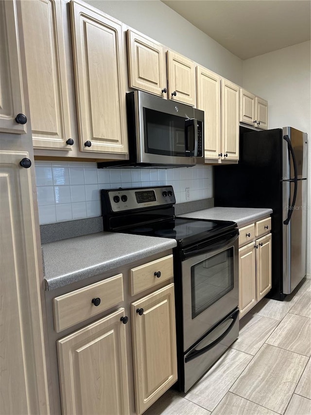 420 Summit Ridge Pl Unit 214, Longwood, FL 32779 - kitchen with stainless steel appliances and light brown cabinetry