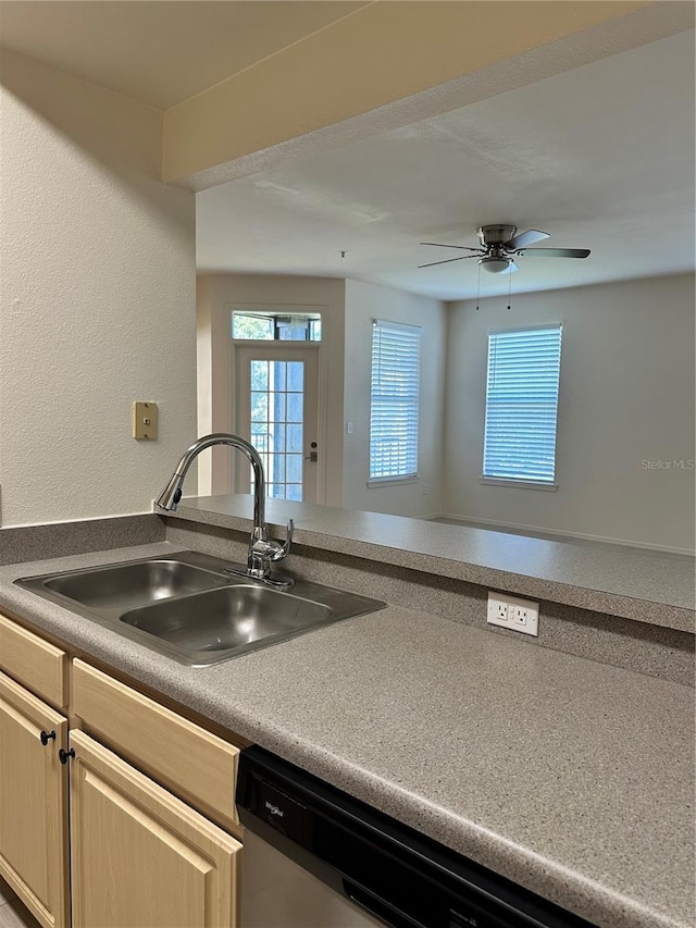 kitchen featuring light brown cabinets, ceiling fan, and sink