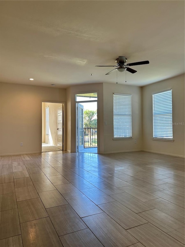 unfurnished room with ceiling fan