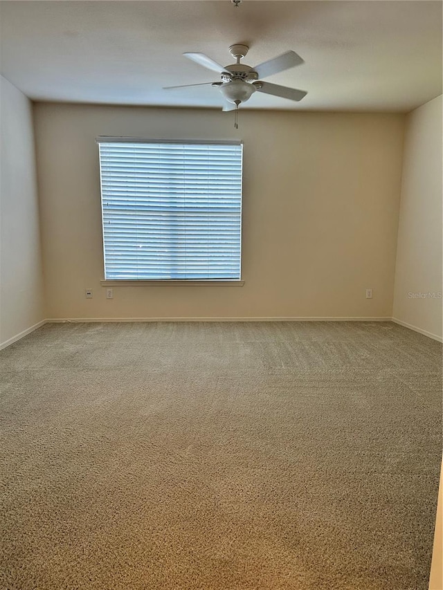 carpeted empty room with ceiling fan