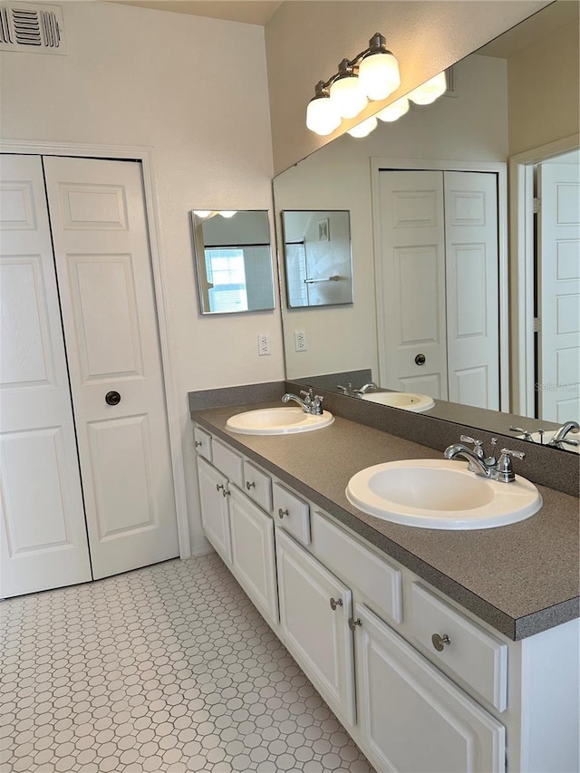 420 Summit Ridge Pl Unit 214, Longwood, FL 32779 - full bathroom featuring double vanity and a closet