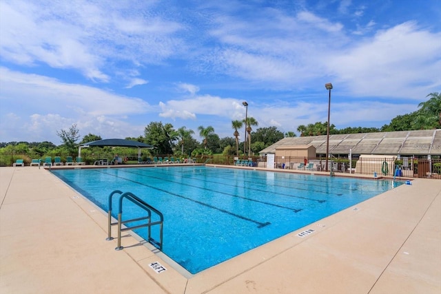 view of pool featuring a patio