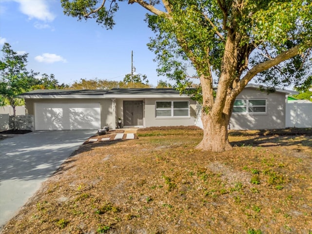 single story home featuring a garage