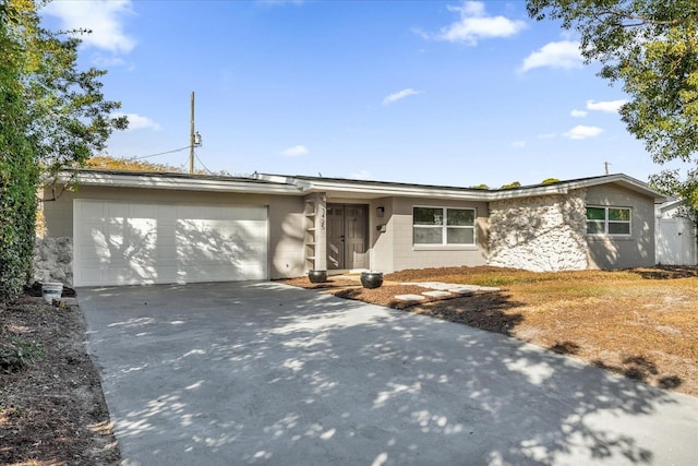 ranch-style home featuring a garage